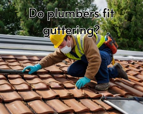 A roofer installing a new gutter on a house roof